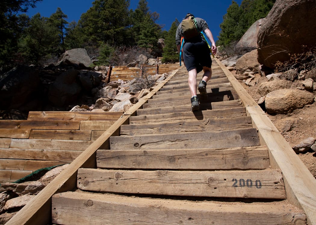Manitou Incline trail showing steep railroad tie steps ascending the mountainside in Colorado Springs