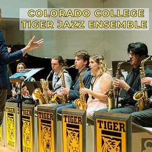 colorado college tiger jazz band practices while instructor raises his hands like a conductor and not like he's mad at his students