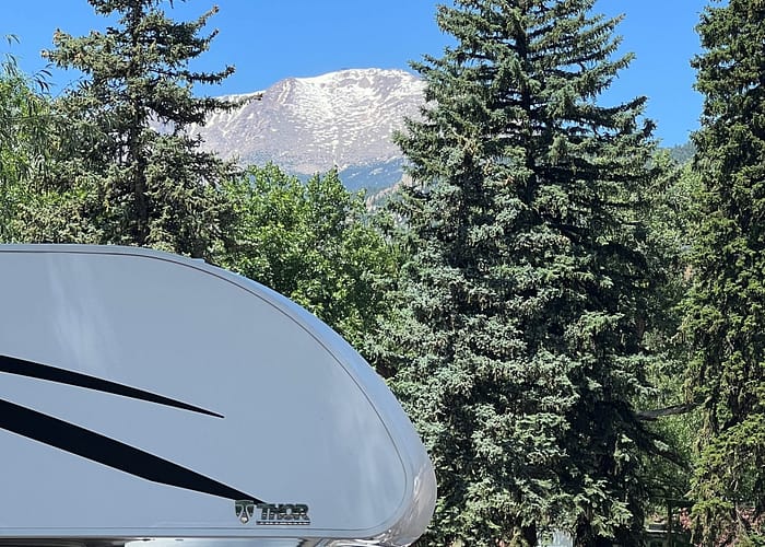 pikes peak with mountains in background
